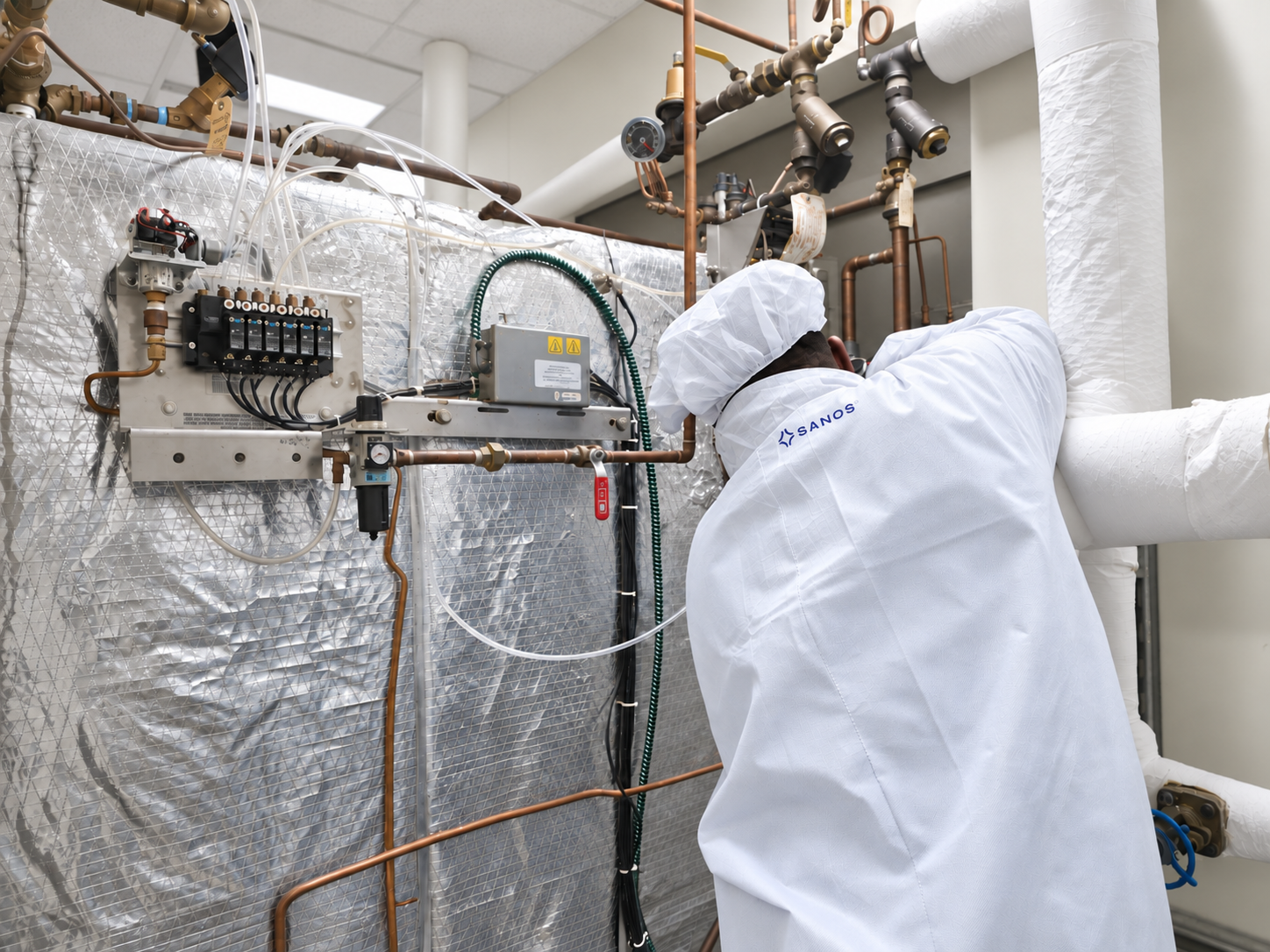 Sanos technician servicing sterilizer equipment
